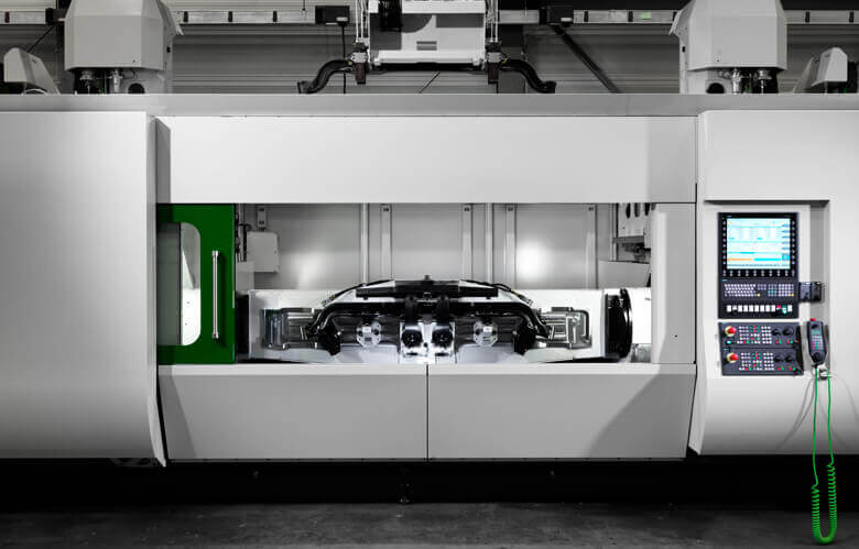 UNITWIN CNC machining centre | Two tilting spindles UNITWIN CNC machining centre | Two tilting spindles | All machining operations for front axles in one machine | unisign.com